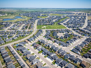 Suburban neighborhood with houses and a few cars