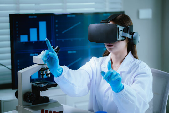 A female scientist wearing virtual reality goggles explores interactive data and medical simulations in a modern laboratory, merging advanced technology with scientific research and innovation.