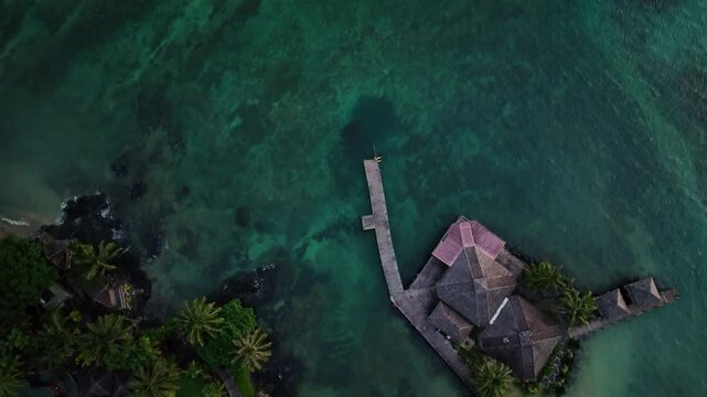 Aerial view of tropical resort and ocean waves, Samoa.