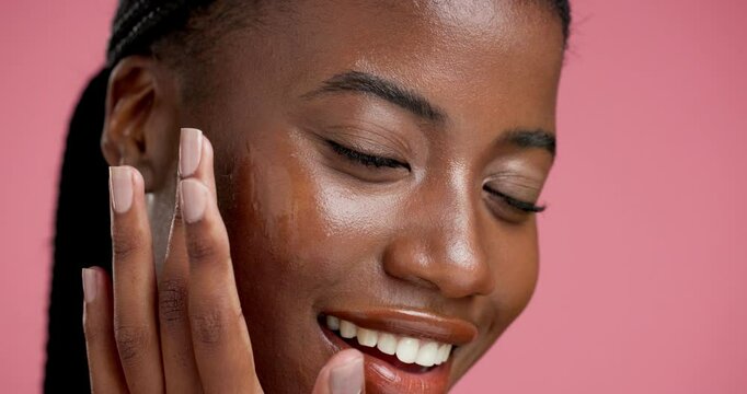 Skincare, black woman and face with serum in studio isolated on pink background for cosmetic. Beauty, smile and African girl with portrait for dermatology, treatment and anti aging product or facial