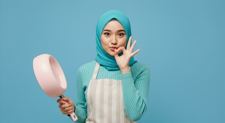 Portrait of Muslim woman chef showing ok gesture