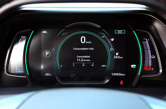 Electric car digital speedometer and tachometer. Electric car dashboard. Close-up view of the modern car dashboard. Acceleration electric vehicle dashboard closeup. Electric Vehicle Dashboard Panel.