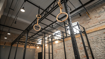 Low-Angle View of Gymnastics Rings Hanging in a Functional Fitness Gym
