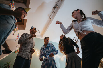 A family enjoying a lively celebration indoors, decorated with festive banners and wearing party hats, highlighting togetherness, fun, and the warmth of a family birthday party in a cozy setting.