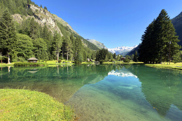 reflection in lake and mountains in gressoney italy