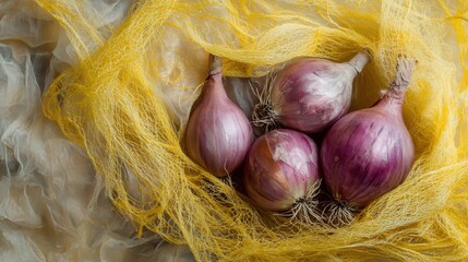 Whole red onions packed in yellow mesh bag, natural organic food background