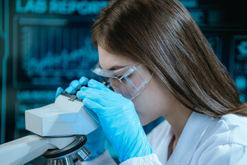 A scientist in a modern laboratory analyzes a blood sample using advanced biotechnology and equipment, conducting medical research for diagnostics, innovation, discovery, and healthcare development.