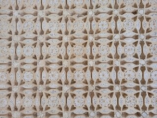 Intricate Geometric and Floral Carved Stone Pattern