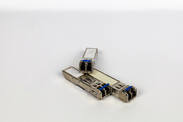 The module is a metal Small Form-Factor Pluggable (SFP) network component for use with fiber optic cables.
