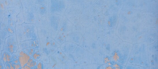 Weathered Blue Wall with Peeling Paint and Cracks