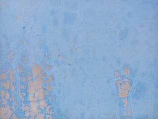 Weathered Blue Wall with Peeling Paint and Cracks