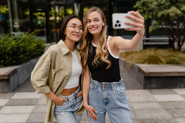 two young pretty women students in street