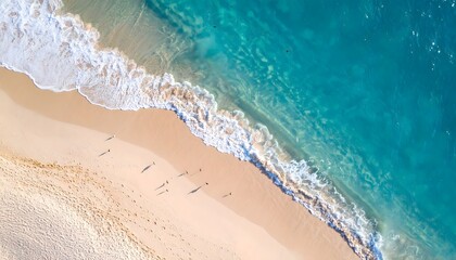 Aerial view of a tropical beach with turquoise water and people walking