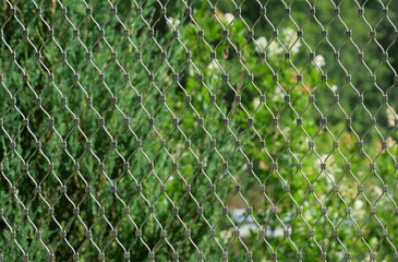 High-quality stainless steel mesh at animal enclosure. Technical, modern, clear structure....