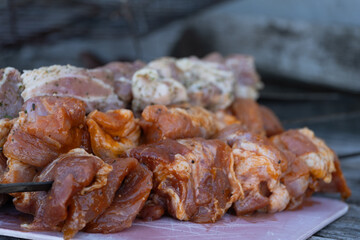 Assorted Marinated Meat Skewers on Cutting Board