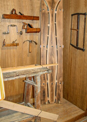 Vintage woodworking tools and handmade ski shop interior.