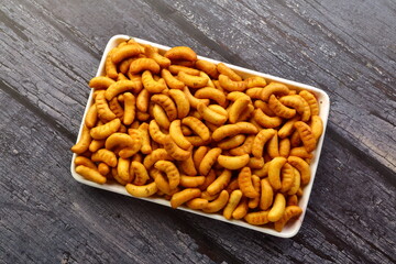 Top view- baked cashew biscuits with exotic spies and herbs.
