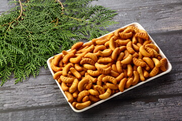 Fresh baked cashew biscuits with spices. tasty appetizers.