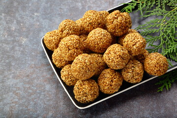 Homemade delicious Indian sweet snack food- sesame balls, ellunda, til ke gole,