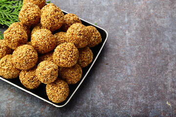 Homemade delicious Indian sweet snack food- sesame balls, ellunda, til ke gole,