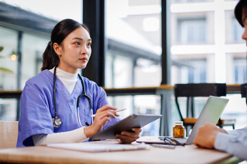 Female nurse hold her man patient's hand. Concept of giving Support. 
