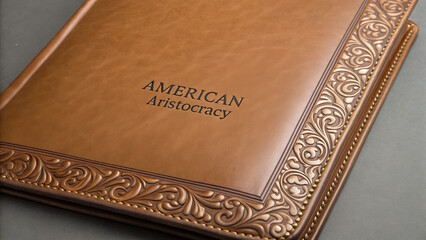 American aristocracy emerged through generations of wealth. Leather-bound book with ornate cover design and embossed text.