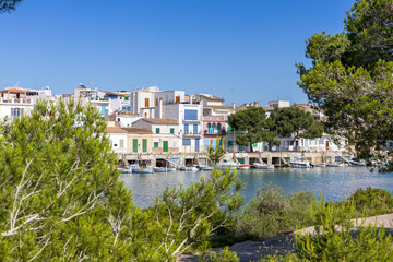 Portocolom fishing village on Mallorca island with boats and colorful houses holiday by the sea in...