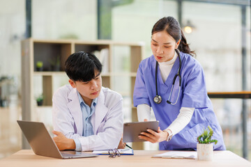 Teamwork, laptop and healthcare with a doctor and nurse working together as a team in the hospital. Collaboration, internet and medical with a man and woman surgeon at work on an online diagnosis 