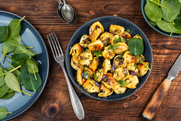 Cooked spinach dumplings in bowl.