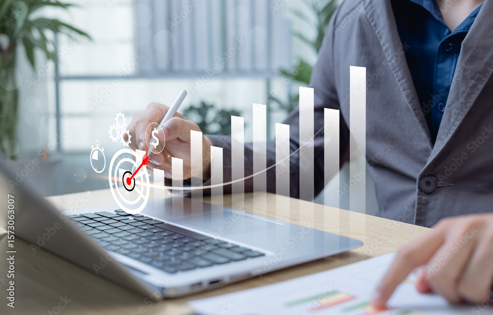 Poster businessman using laptop to display cost control and budgeting graphs. visualizing cost reduction, p