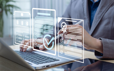 Businessman reviewing documents on laptop with checkmark and file icons. Concept of quality control, validation, auditing, approval, compliance, and document workflow management.