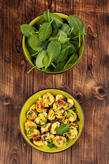 Cooked spinach dumplings in bowl.