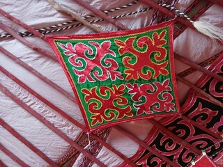 tradational kazak yurt interior with colorful carpets
