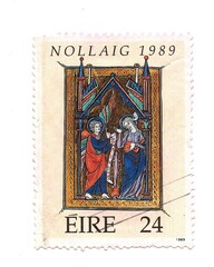 A vintage Christmas postage stamp from Ireland isolated on a white background.