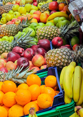 Vibrant display of fresh fruits in a marketplace captured during a sunny afternoon