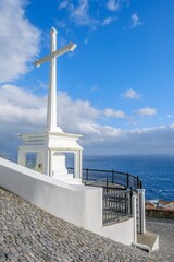 White Cross Monument Overlooking Atlantic Ocean in Sao Jorge Island Azores. Portuguese religious...