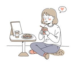 Teenager  eat and enjoying a meal while chatting on a tablet in a cozy setting
