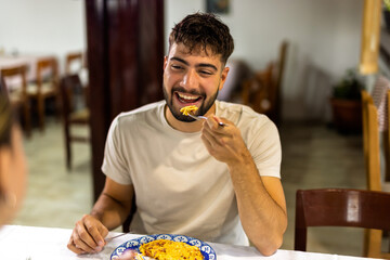  Young Man Eating Breakfast with Girlfriend at Cozy Table