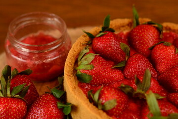 Close up cheesecake with strawberries and jam