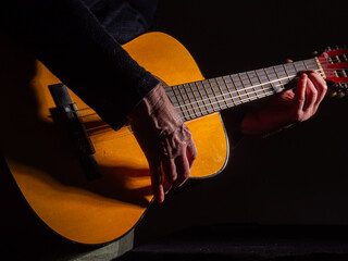 Hands playing guitar close up shot 