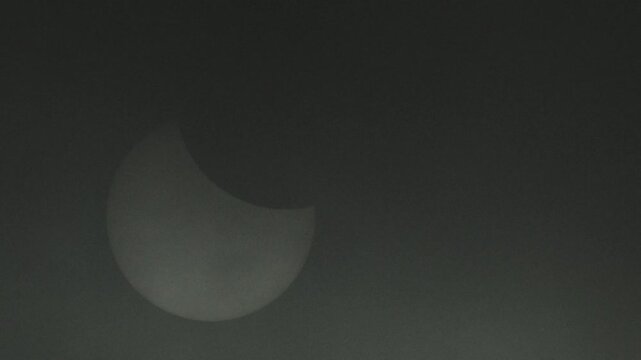 Solar eclipse obscured by thick clouds