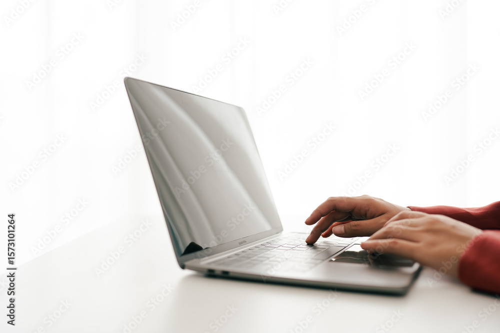 Canvas Prints close-up portrait typing keyboard on laptop computer. working online on white table at office. faceb