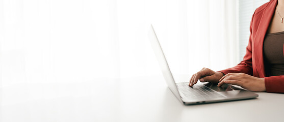 Close-up portrait typing keyboard on laptop computer. Working online on white table at office. Facebook chat. Website meeting. Blogger. Journalist writing articles. online job ideas