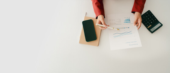 Accountant working on desk using calculator to calculate financial report in office business accounting finance concept