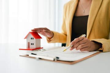 Real estate agent buys houses and land, delivers keys and house to customers after agreeing to sign...