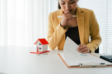 Portrait of a Home Purchase Agreement
Real estate agent delivers a model home to a client, mortgage, loan, lease-purchase agreement, and home sale.