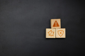 Alert, Virus, Security Shield Icon on Wooden Blocks