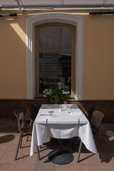 A Charming Outdoor Dining Setup Featuring an Elegant Table and Inviting Ambiance