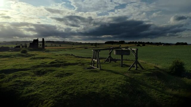 Drone shot of the Magpie Mine near the village of Sheldon in Derbyshire, England, UK at sunset