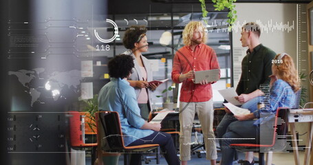 Team of five collaborating in office, with laptop tablet printed papers chairs desk potted plants